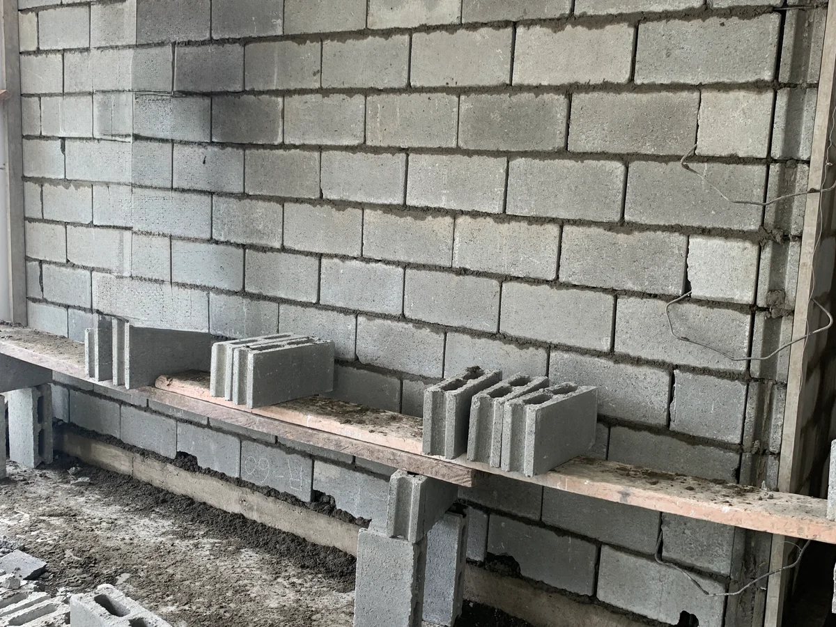 Concrete block wall construction in progress